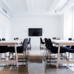 Empty corporate office with glowing AI interface symbolizing automation and job displacement.